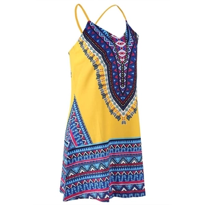 Detail of yellow boho mini dress with geometric print and cross back thin straps