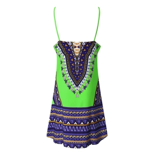 Detail of emerald green summer dress featuring vibrant ethnic Dashiki print patterns