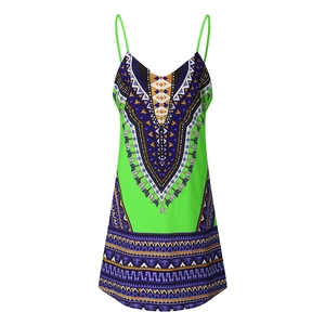 Detailed view of bohemian floral print and neat stitching on green summer slip dress