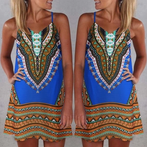 Detail of blue boho mini dress showing symmetrical geometric patterns and V-neckline