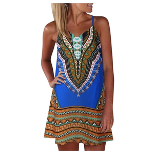Detailed view of bohemian floral print and ethnic patterns on blue sleeveless mini dress