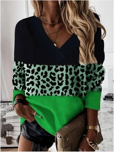 Detail of V-neck long-sleeve top featuring leopard print and green color block stitching