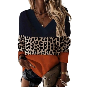 Women's V-neck long sleeve top with blue, leopard print, and orange patchwork design