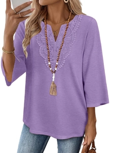 Detail of V-neckline with delicate lace embroidery on this purple boho-style tunic top