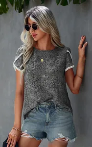 Detail of lace sleeve patchwork and polka dot pattern on women casual short sleeve t-shirt