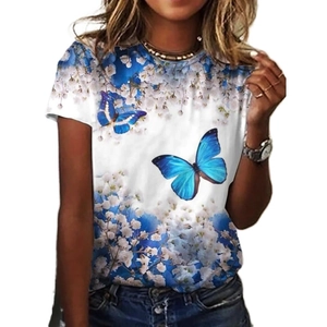 Detail of blue butterfly and white flower print on a white crew neck short sleeve t-shirt