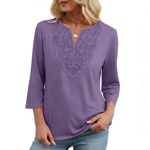 Detailed view of V-neckline with intricate lace crochet inserts on purple top