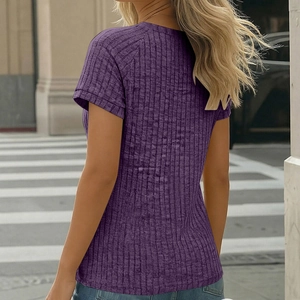 Detail of dark purple ribbed knit slim fit T-shirt with raglan sleeve design for women