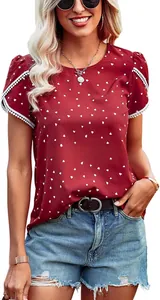 Close-up of elegant burgundy lace patchwork short sleeve top with heart pattern