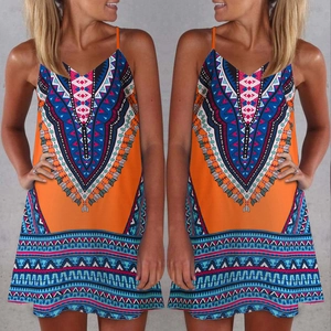 Detail of bohemian ethnic print on orange A-line mini dress with sleeveless straps