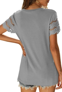 Close-up of gray short-sleeve T-shirt with intricate lace hollow-out detail on cuffs