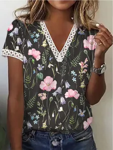 Detailed close-up of delicate white lace trim on a V-neck floral summer t-shirt