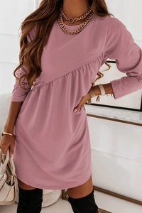 Detail view of pink long sleeve dress featuring asymmetrical waist pleats and stitching