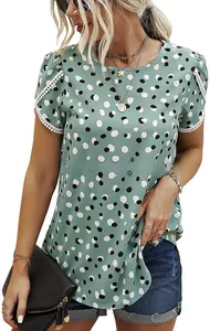 Close-up of green polka dot t-shirt featuring elegant white lace embroidery on sleeves