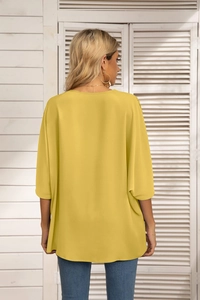 Back view of a loose yellow batwing sleeve chiffon blouse with casual round neck style