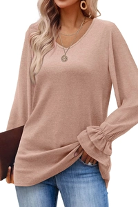 Detailed macro view of the flare cuff design on this pink long sleeve knit top