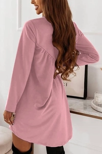 Detail view of pink long sleeve dress featuring an elegant pleated back design