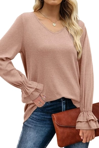 Detail of elegant V-neck knit top with layered ruffle cuffs in dusty pink color
