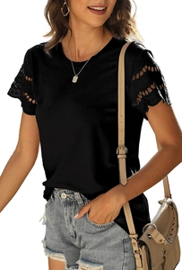Detailed close-up of feminine black T-shirt with intricate lace patchwork sleeves