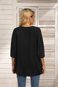 Back view of a black loose-fit chiffon blouse with batwing sleeves and round neckline
