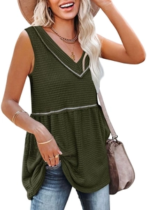 Macro detail of dark green sleeveless V-neck top in waffle knit fabric with white piping trim
