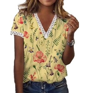 Detailed view of floral V-neck top with intricate white lace trim on sleeves and neckline