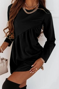 Detail of black long-sleeve dress featuring elegant diagonal ruffle trim on the front
