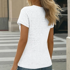 Street style back view of a slim-fit white ribbed knit t-shirt with button detail