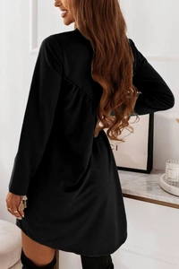 Detail shot of the back of a slim-fit black long-sleeve knit dress with pleat textures