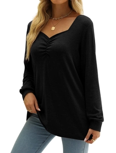 Close-up of ruched V-neck detail on a slim-fit black long-sleeve knit top for women