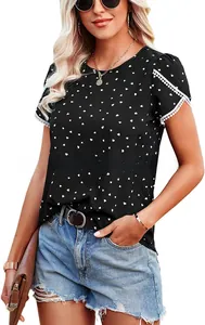 Detail of black short sleeve top featuring heart prints and delicate white lace cuffs