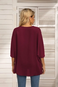 Rear view of a burgundy batwing sleeve chiffon blouse with loose fit and airy texture