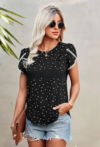 Close-up of black short sleeve top with heart pattern and white lace sleeve detailing
