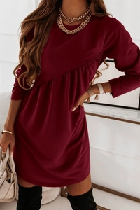 Detail view of the elegant burgundy long-sleeved dress with unique ruched side pleats