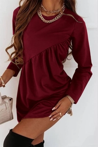 Close-up of wine red long sleeve dress featuring unique diagonal ruffle trim details