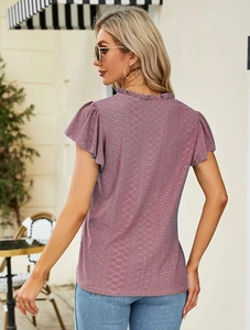 Close-up of the elegant V-neck and delicate jacquard hollow lace texture on purple top