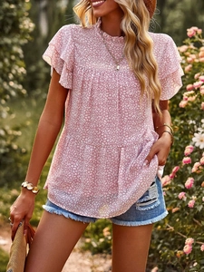 Detail view of pink chiffon blouse with layered ruffle sleeves and delicate white patterns