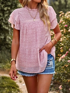 Detail of pink leopard print chiffon top with tiered ruffle layers and stand collar