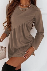 Detail of the diagonal ruffled waistline and side ruching on a solid coffee mini dress