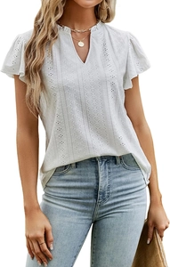 Detail of white jacquard V-neck blouse with eyelet lace embroidery and flutter sleeves