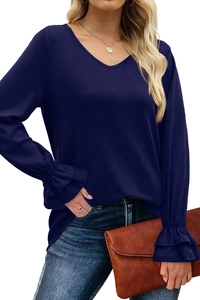 Detail of navy V-neck top showing elegant double-layer ruffle cuffs on long sleeves
