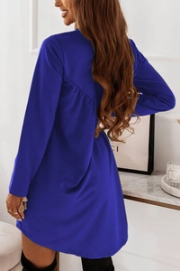 Detail view of the pleated back design on a royal blue long sleeve casual dress