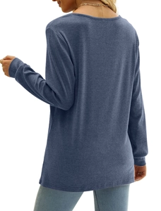 Detail showing the back of a blue-gray long sleeve knit top with a classic round neck