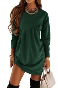 Detail of dark green long sleeve dress featuring asymmetrical seams and pleated texture
