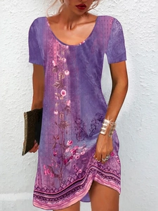 Detail view of purple floral print dress featuring a round neck and ethnic geometric hem