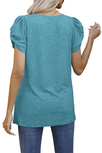 Detailed back view of light blue puff sleeve t-shirt with textured knit fabric