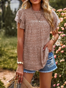 Detailed view of ruffle round neck and polka dot animal print on chiffon blouse
