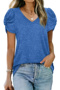Detail of royal blue V-neck t-shirt featuring pleated puff sleeve texture and knit fabric