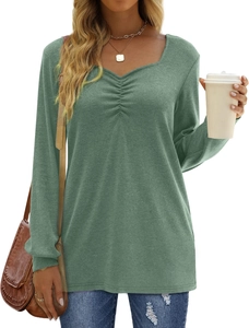 Detail view of sage green long sleeve top featuring ruched V-neckline and soft knit fabric