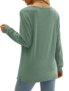 Rear view of a sage green long sleeve t-shirt with ribbed cuffs and textured fabric